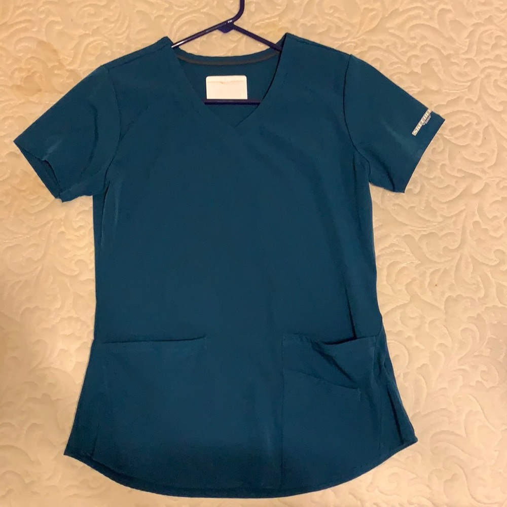 Teal scrub top.
